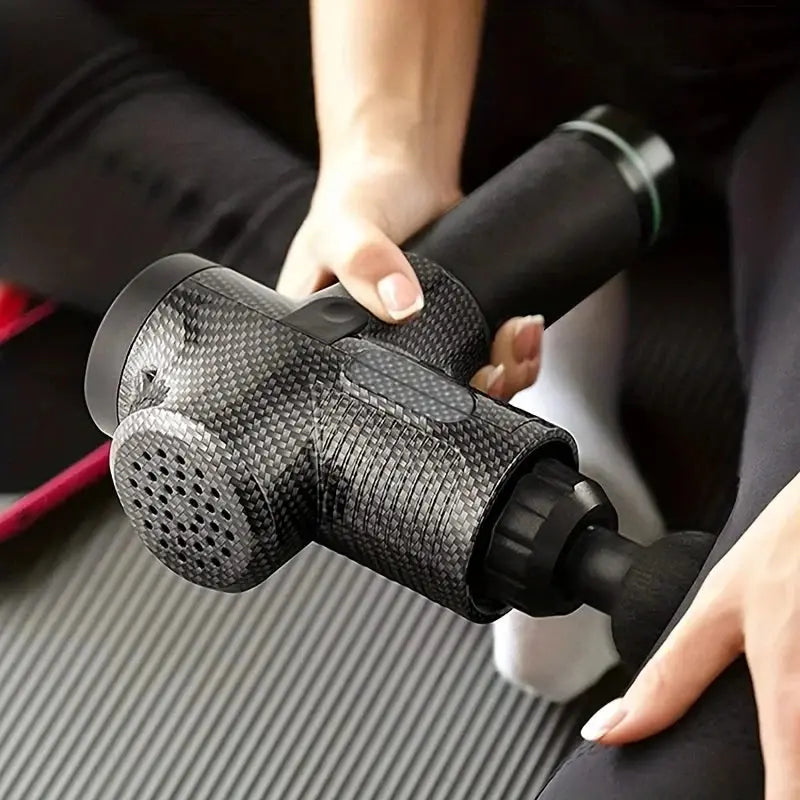 Athlete using FODRK Deep Tissue Massage Gun for post-workout muscle recovery & stress relief